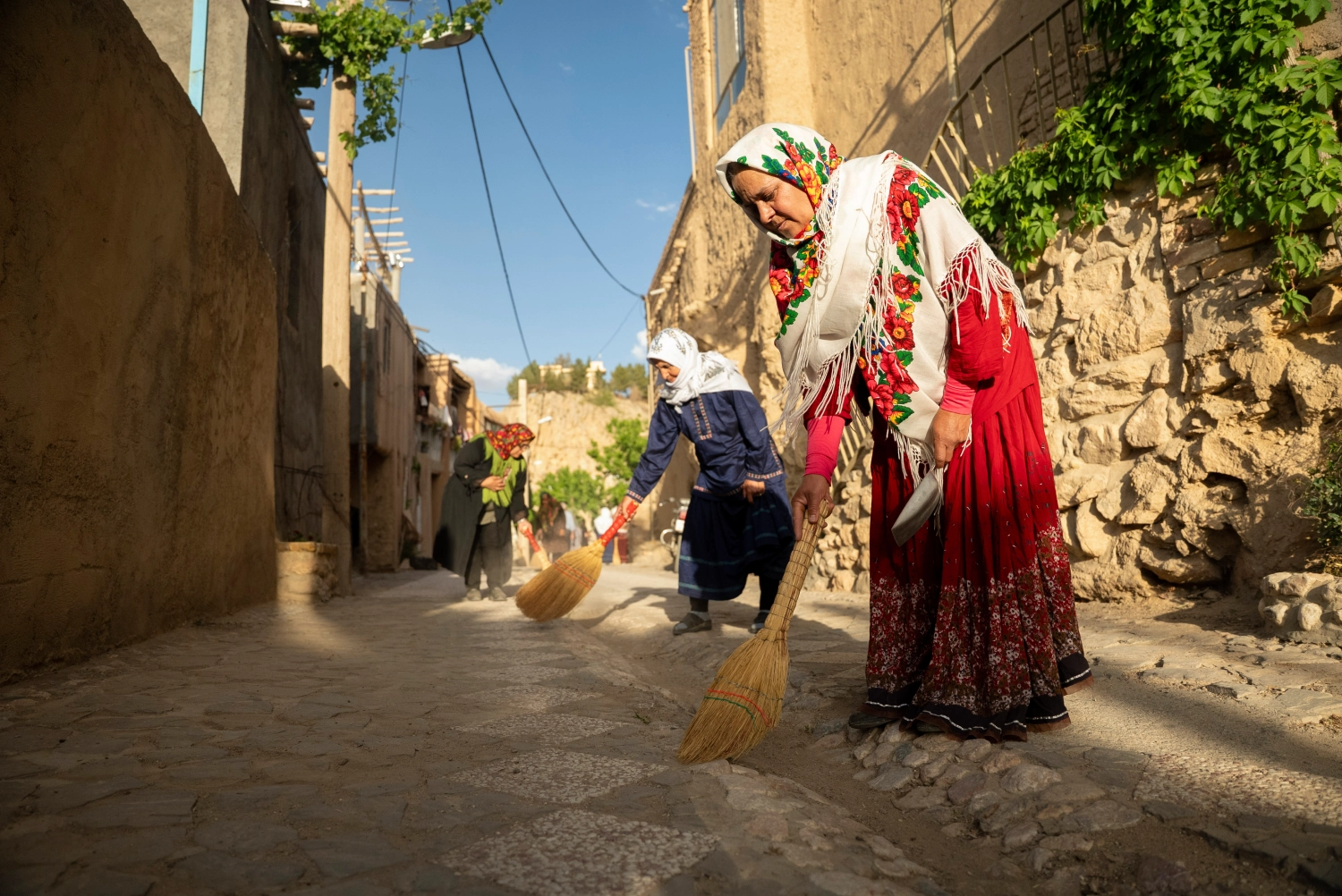Women helping and cleaning roads in Qaleh Bala